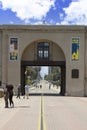 People in the courtyard between two archways at Balboa Park, San Diego CA