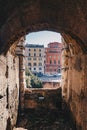Archway in Colosseum with Rome city streets visible Royalty Free Stock Photo