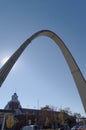 Archway entrance over a bridge with blue sky background