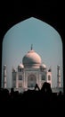 Archway frames the distant view of a modern building in Taj Mahal, Agra Royalty Free Stock Photo