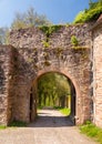 Archway and gate in old castle wall Royalty Free Stock Photo