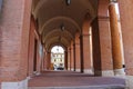 Archway with hanging lanterns of ancient building on Cavour square in Rimini, Italy Royalty Free Stock Photo