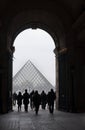 Archway and Louvre pyramid Royalty Free Stock Photo