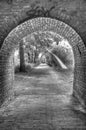 An archway over a cobbled path