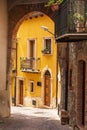 An archway over a narrow cobblestone street in the medieval hill town of Caronia Royalty Free Stock Photo