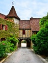 Archway over a street in the village of Autoire, France