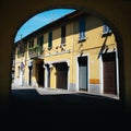 Archway to a street with traditional shops in Italy Royalty Free Stock Photo