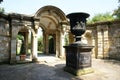 Archway and urn on a plinth at the Italian garden of Hever castle in England Royalty Free Stock Photo