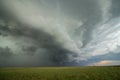An arcing shelf cloud races forward as a severe thunderstorm approaches. Royalty Free Stock Photo