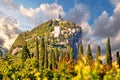 Arco castle ruins on cliffs above Garda lake Royalty Free Stock Photo