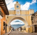 Arco de Santa Catalina and colonial houses in tha street view of Royalty Free Stock Photo