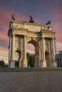 Arco della pace in Milan at sunset. Detail of the clock tower of the Sforza Castle XV century Castello Sforzesco . It is one of