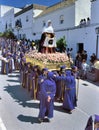 A group of female bearers called Costaleros carrying a religious float