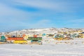 Arctic city center with colorful Inuit houses on the rocky hills covered in snow, Ilulissat, Avannaata municipality, Greenland Royalty Free Stock Photo