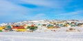 Arctic city center panorama with colorful Inuit houses on the rocky hills covered in snow, Ilulissat, Avannaata municipality, Royalty Free Stock Photo