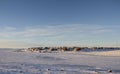 Arctic community of Cambridge Bay in the fall with snow on the ground and blue skies Royalty Free Stock Photo