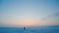 View of snowy plain of frozen lake at sunset Royalty Free Stock Photo