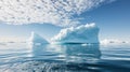 Arctic Majesty Serene Iceberg Formation Below Cloudscape Reflected in Glacial Waters Royalty Free Stock Photo