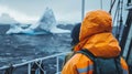 Arctic researchers observing icebergs from a ship on a polar expedition
