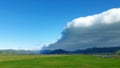 Arcus cloud formation in the form of shelf or rolling clouds over rural mountain landscape