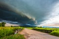 Arcus clouds over the country road Royalty Free Stock Photo