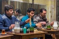 ARDABIL, IRAN - APRIL 10, 2018: People eat Dizi Abgoosht , traditional Iranian stew, in a local tea house in Ardabil, Ir