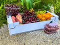 Box with fruits, raspberries, cherries, apricots, peaches, grapes Royalty Free Stock Photo