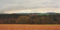 Ardennes landscape,with empty winter rfarmland and forests and hills on a cloudy day Royalty Free Stock Photo