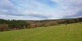 Ardennes landscape with flanks of rolling hills with pine and other trees Royalty Free Stock Photo