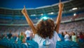 Ardent boy football fan celebrates team victory at stadium stands. Generative AI