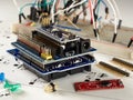 Arduino and programmers with peripherals and expansion boards lie on a gray background. do it yourself.Arduino micro.Arduino macro