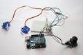 Arduino uno board connected to micro servo and joystick using jumper wires and breadboard. Arduino Uno project prototyping