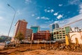 An area cleared for construction in the foreground with a cluster of high rise buildings in the background Royalty Free Stock Photo