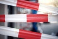 Area closed with bright red and white barricade tape. Royalty Free Stock Photo