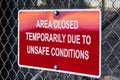 `Area closed temporarily due to unsafe conditions` posted sign