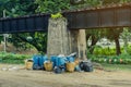 The area that dumped garbage under The Bridge of the River Kwai in Kanchanaburi, Thailand. pollution garbage waste, lots of junk