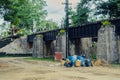 The area that dumped garbage under The Bridge of the River Kwai in Kanchanaburi, Thailand. pollution garbage waste, lots of junk