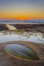 Sunset over tide pool in La Jolla, California