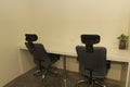 area modern co working space with black chair,table,leaf bright modern working space with blurred