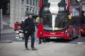 Area near Liverpool street at noon in the backlight. People hurry about their business. East London. People cross the road