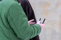 Area planners survey the surroundings with a drone, close-up of hands with a drone remote controller