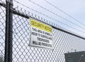 Area Under Surveillance warning sign on wire fence Royalty Free Stock Photo