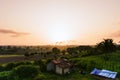 Areal shot of agriculture field , Smoke stack from factory polluting environment in the background Royalty Free Stock Photo