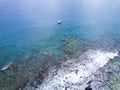 Areal view blue ocean yacht with coral reef