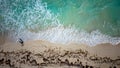 Areal view of Caribbean shoreline, With Turquoise water hitting the sandy beachin Mexico