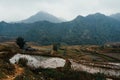An areal view of a rural landscape lined with small, rustic houses: Sapa, Northern Vietnam