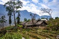 An areal view of a rural landscape lined with small, rustic houses: Sapa, Northern Vietnam