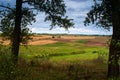 Arable, green and harvested fields, landscapes of lines and hills. Agriculture, agrarian areas, the beginning and end of Royalty Free Stock Photo