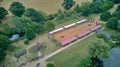 Arena for the jousting tournament, surrounded by green trees. Warwick, United Kingdom.