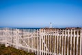 Arena Lighthouse behind old fence